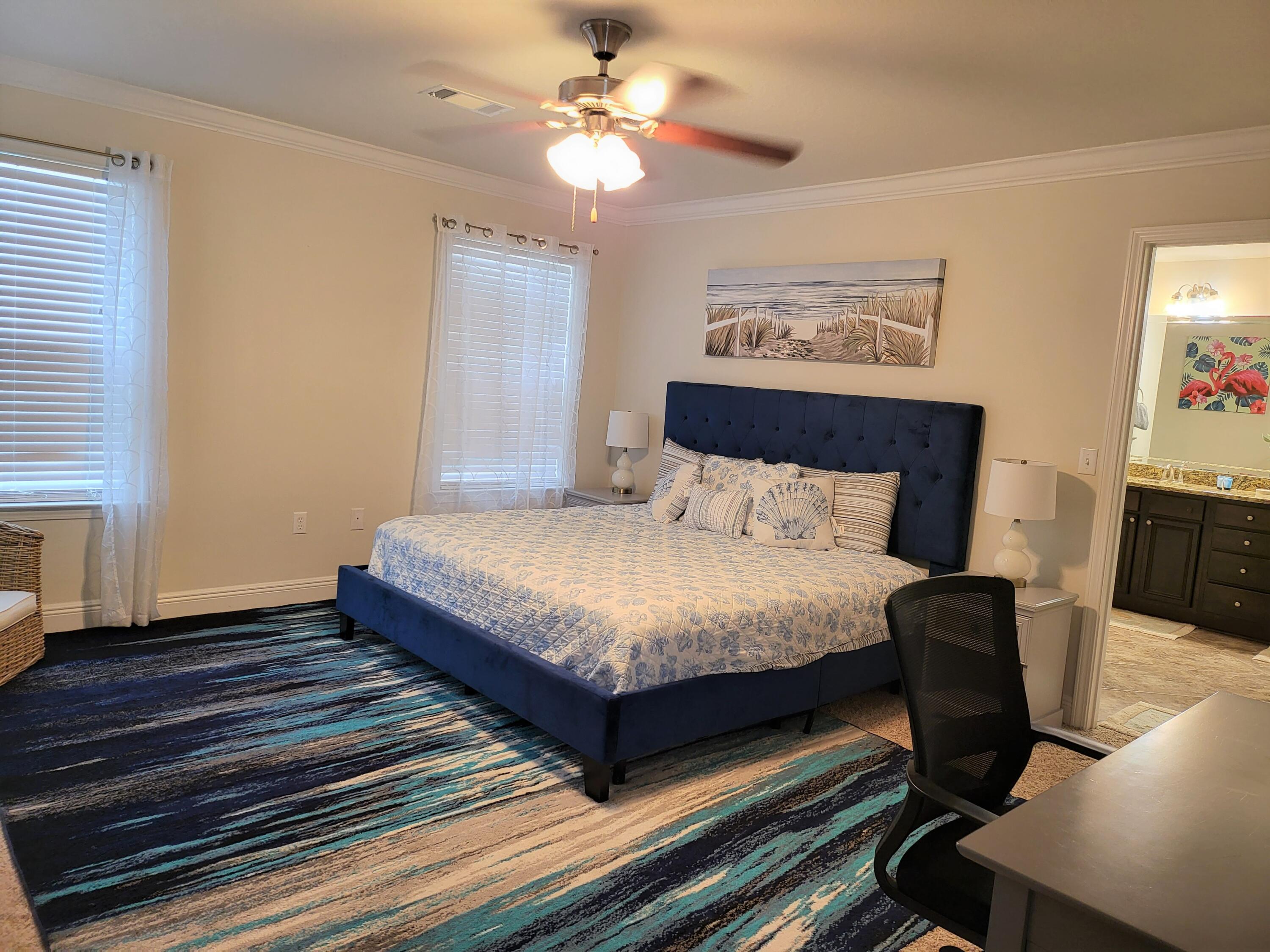 27 Topside Drive Inlet Beach, FL 32461 - Photo 19 of 33 a bedroom with a bed and a chandelier