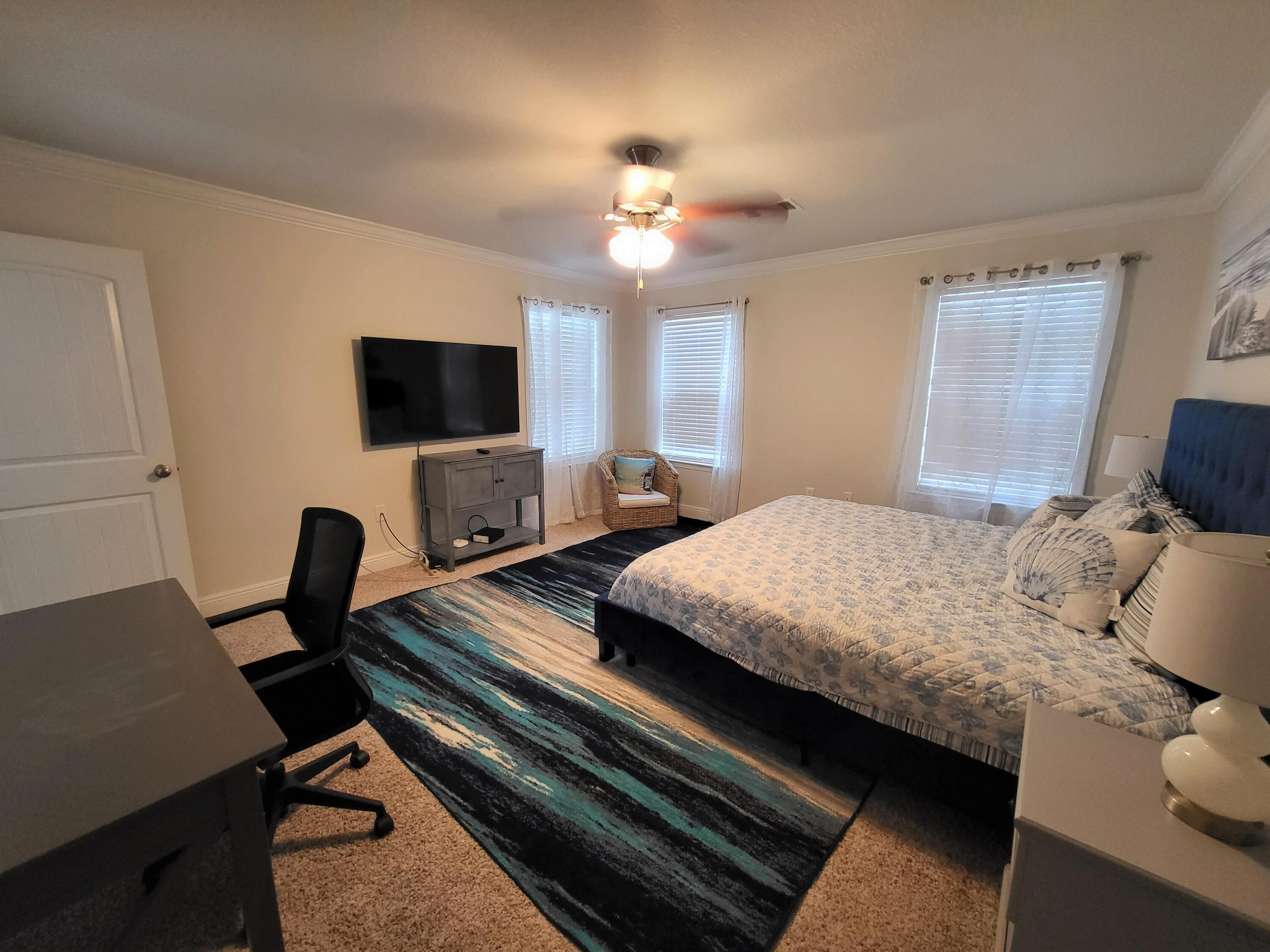 27 Topside Drive Inlet Beach, FL 32461 - Photo 20 of 33 a bedroom with a bed window and a flat screen tv