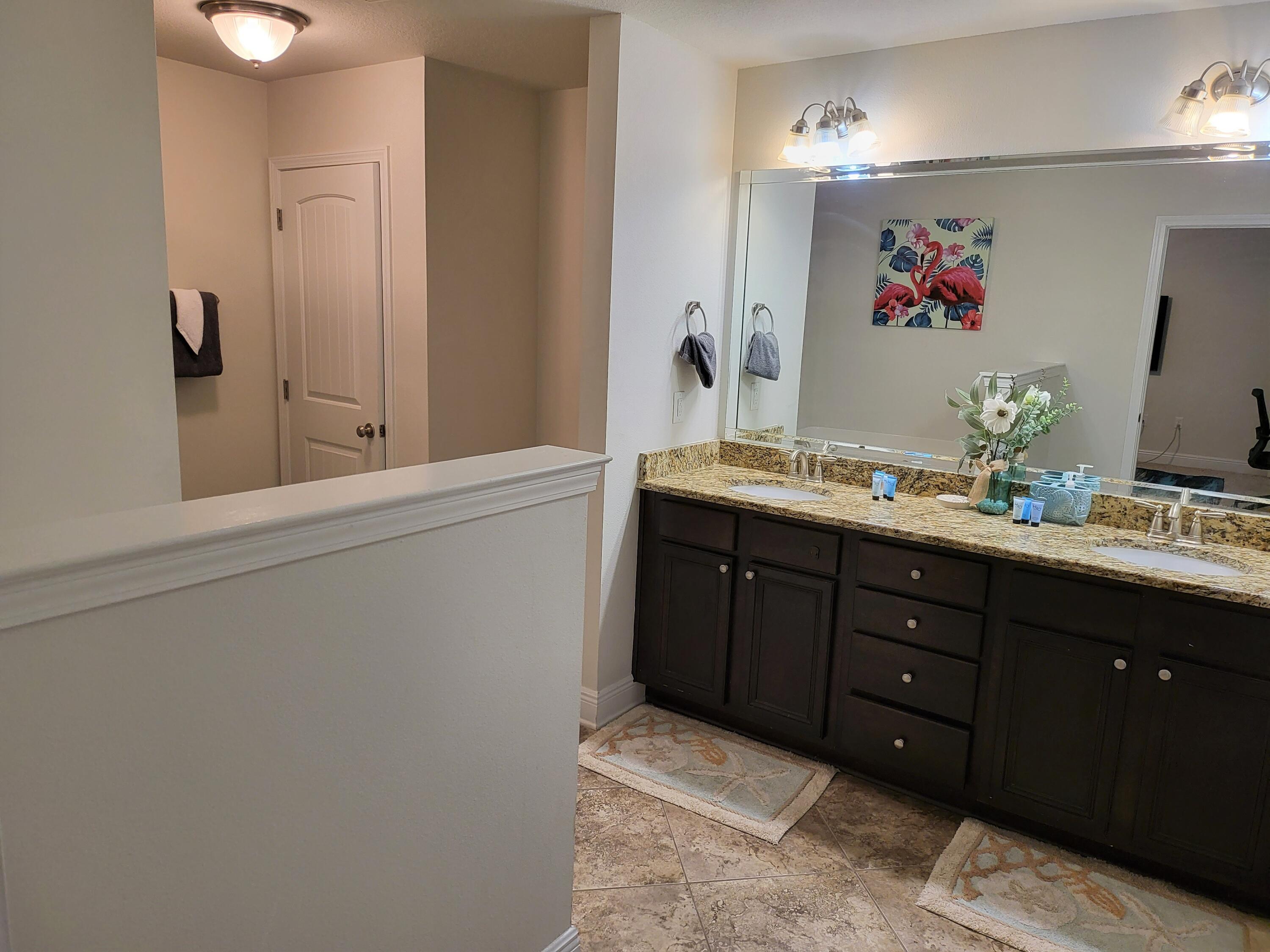 27 Topside Drive Inlet Beach, FL 32461 - Photo 21 of 33 a bathroom with a double vanity sink and a mirror