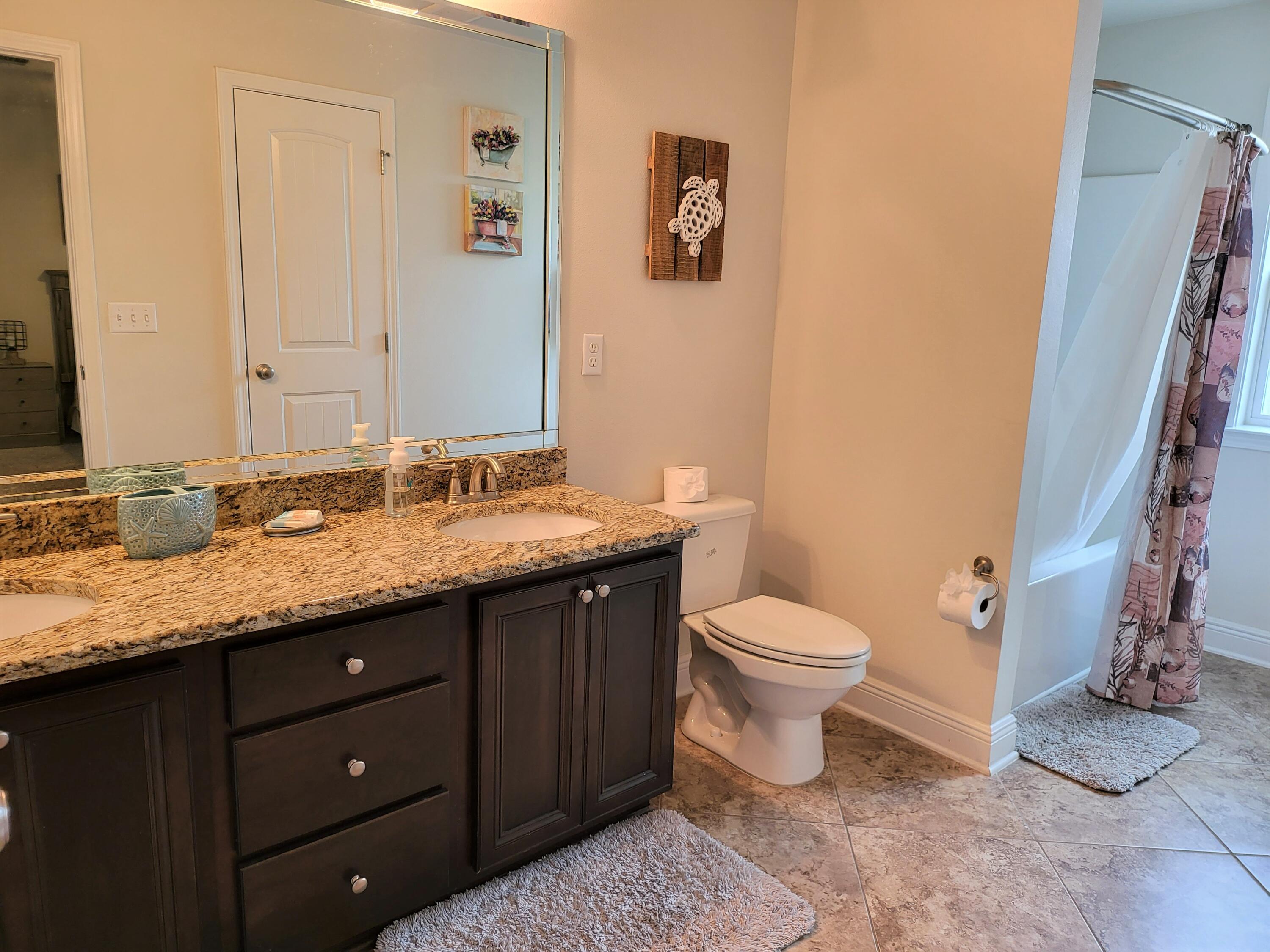 27 Topside Drive Inlet Beach, FL 32461 - Photo 30 of 33 a bathroom with a granite countertop sink toilet and shower
