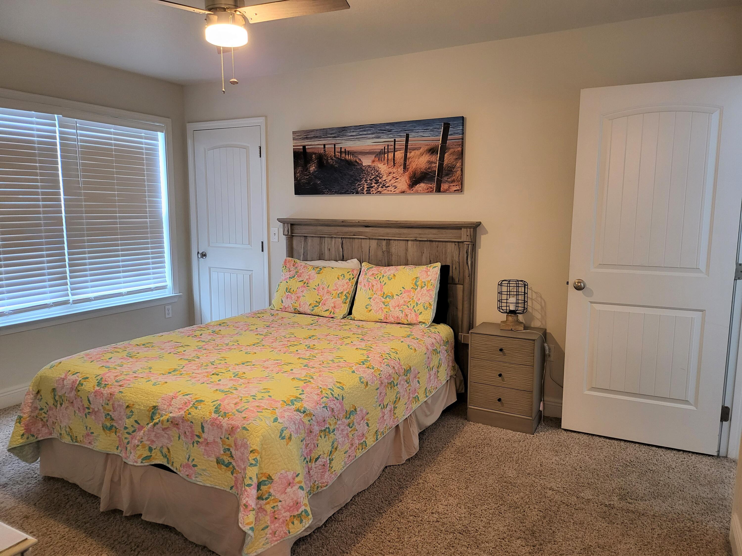 27 Topside Drive Inlet Beach, FL 32461 - Photo 31 of 33 a large bed sitting in a bedroom next to a window and a chandelier
