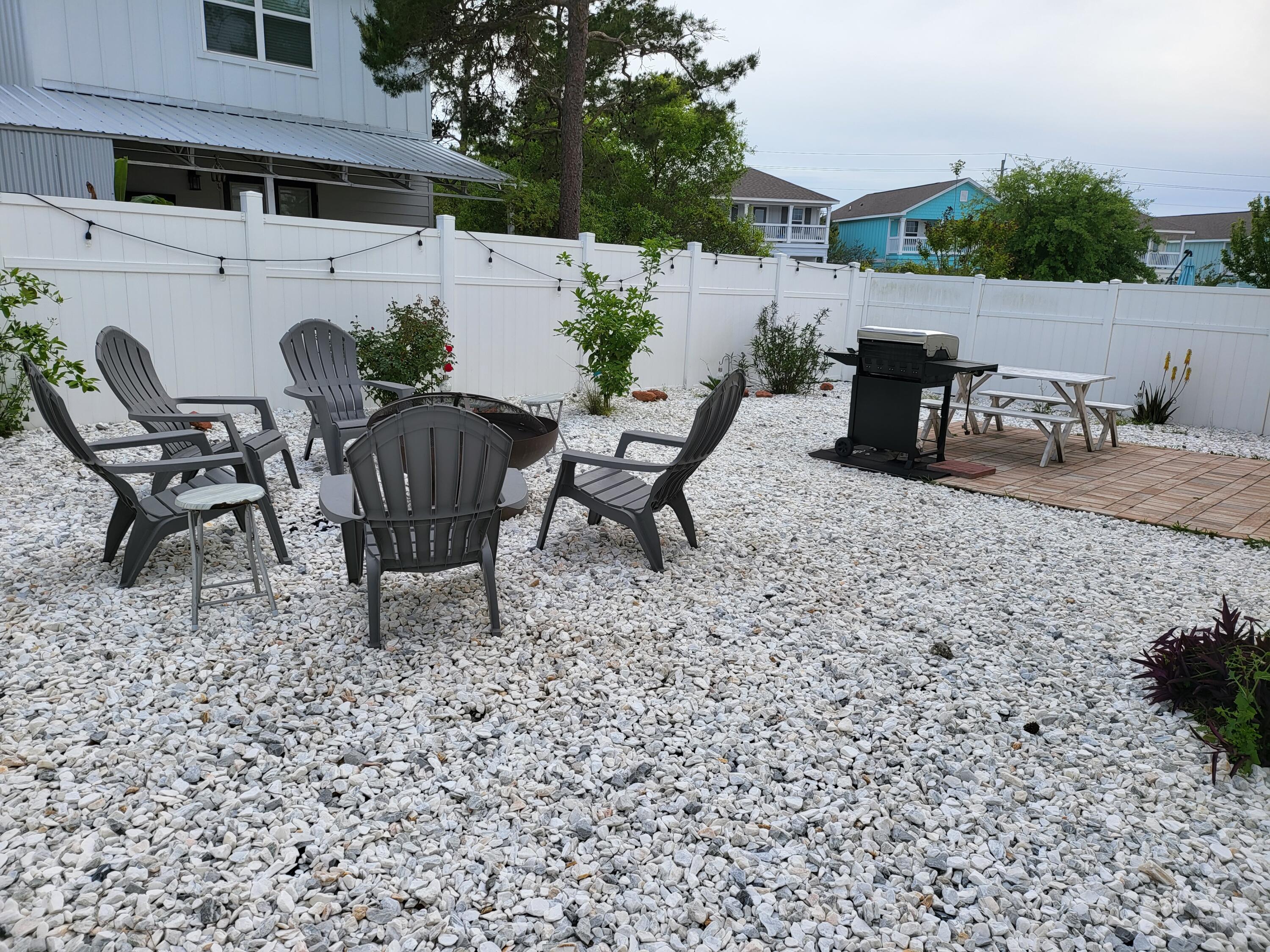 27 Topside Drive Inlet Beach, FL 32461 - Photo 4 of 33 a view of a backyard with furniture