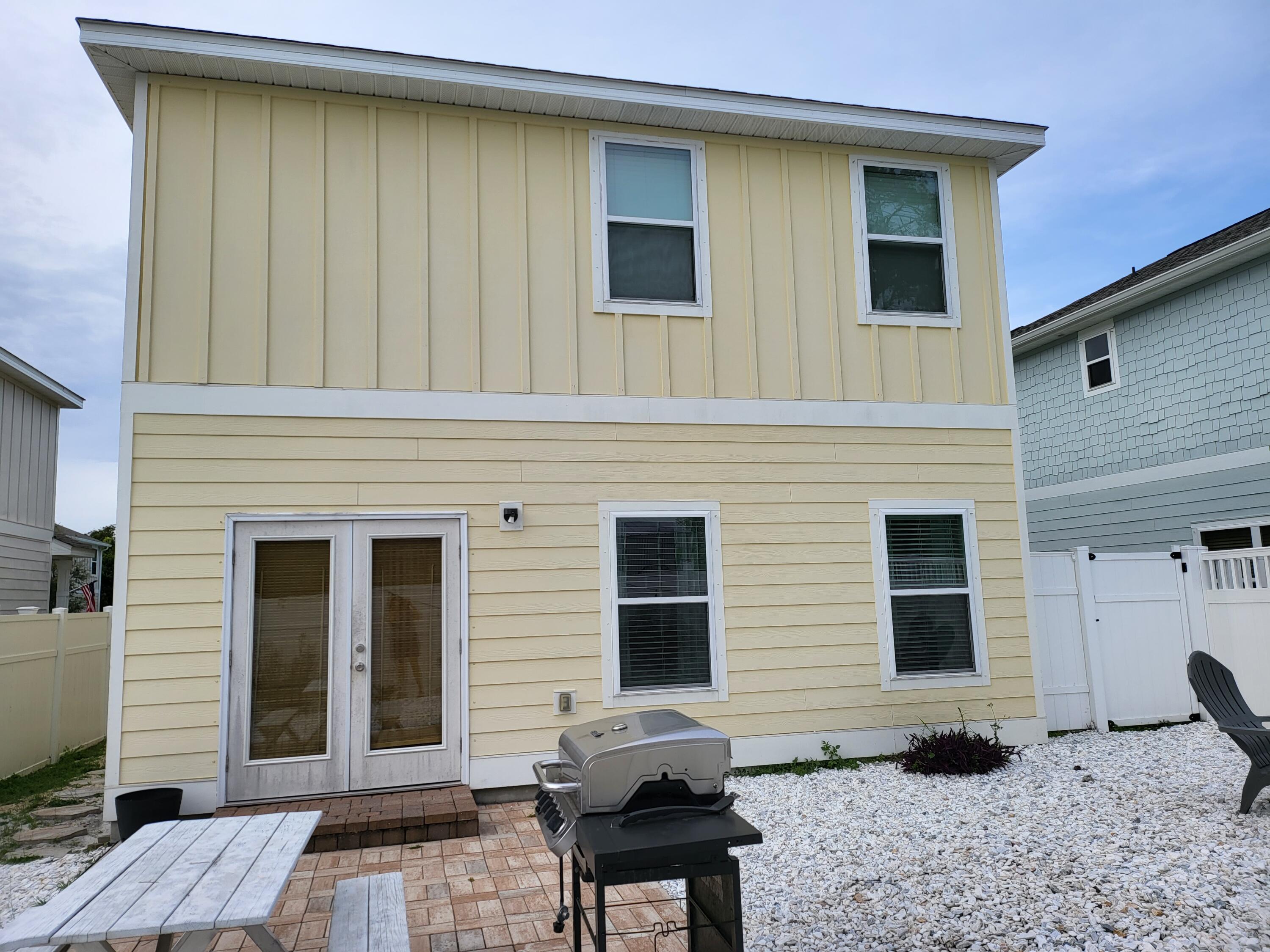27 Topside Drive Inlet Beach, FL 32461 - Photo 5 of 33 a backyard of a house with seating space