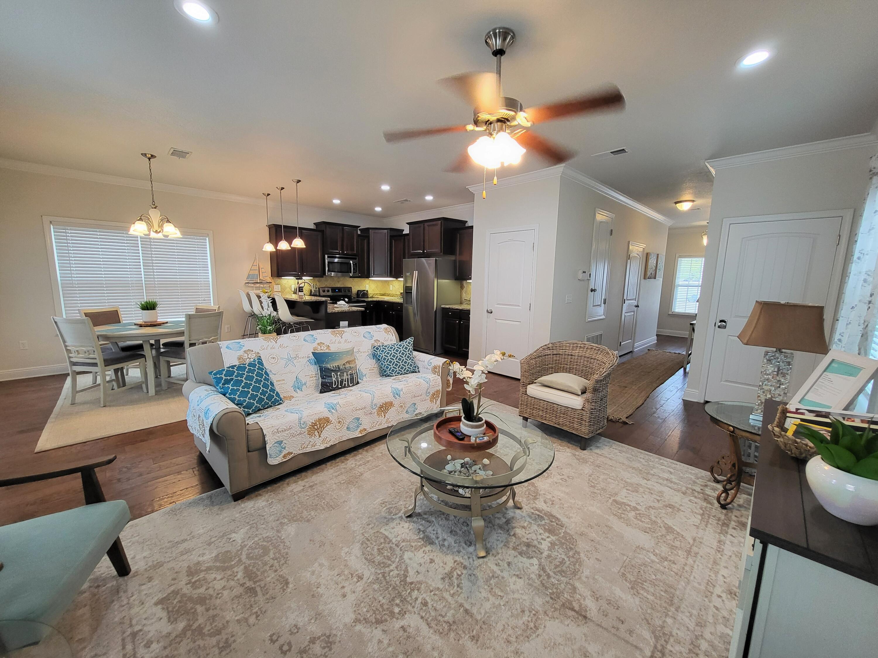 27 Topside Drive Inlet Beach, FL 32461 - Photo 9 of 33 a living room with furniture kitchen view and a chandelier