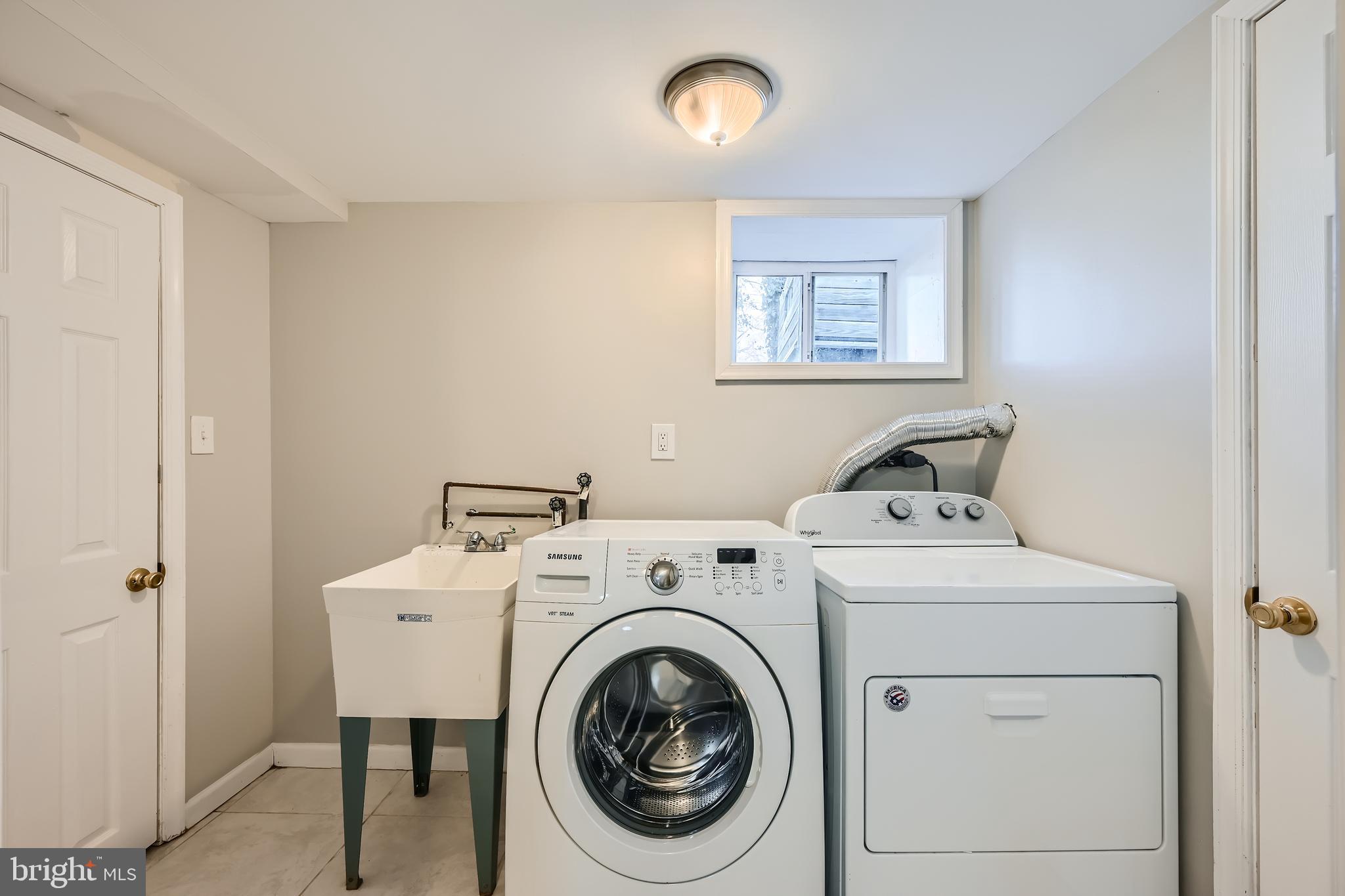 5531 Ritter Avenue Baltimore, MD 21206 - Photo 23 of 37 Side by side washer and dryer with utility sink!