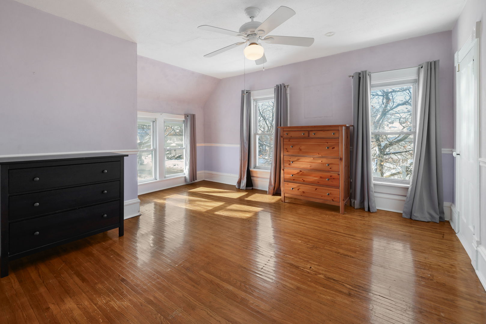 217 Henry Street Elgin, IL 60120 - Photo 10 of 17 wooden floor in an empty room with a window