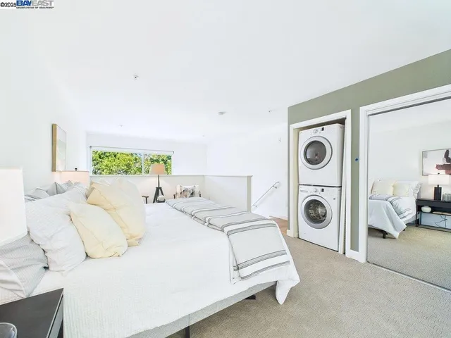 a bed room with a bed and white wall