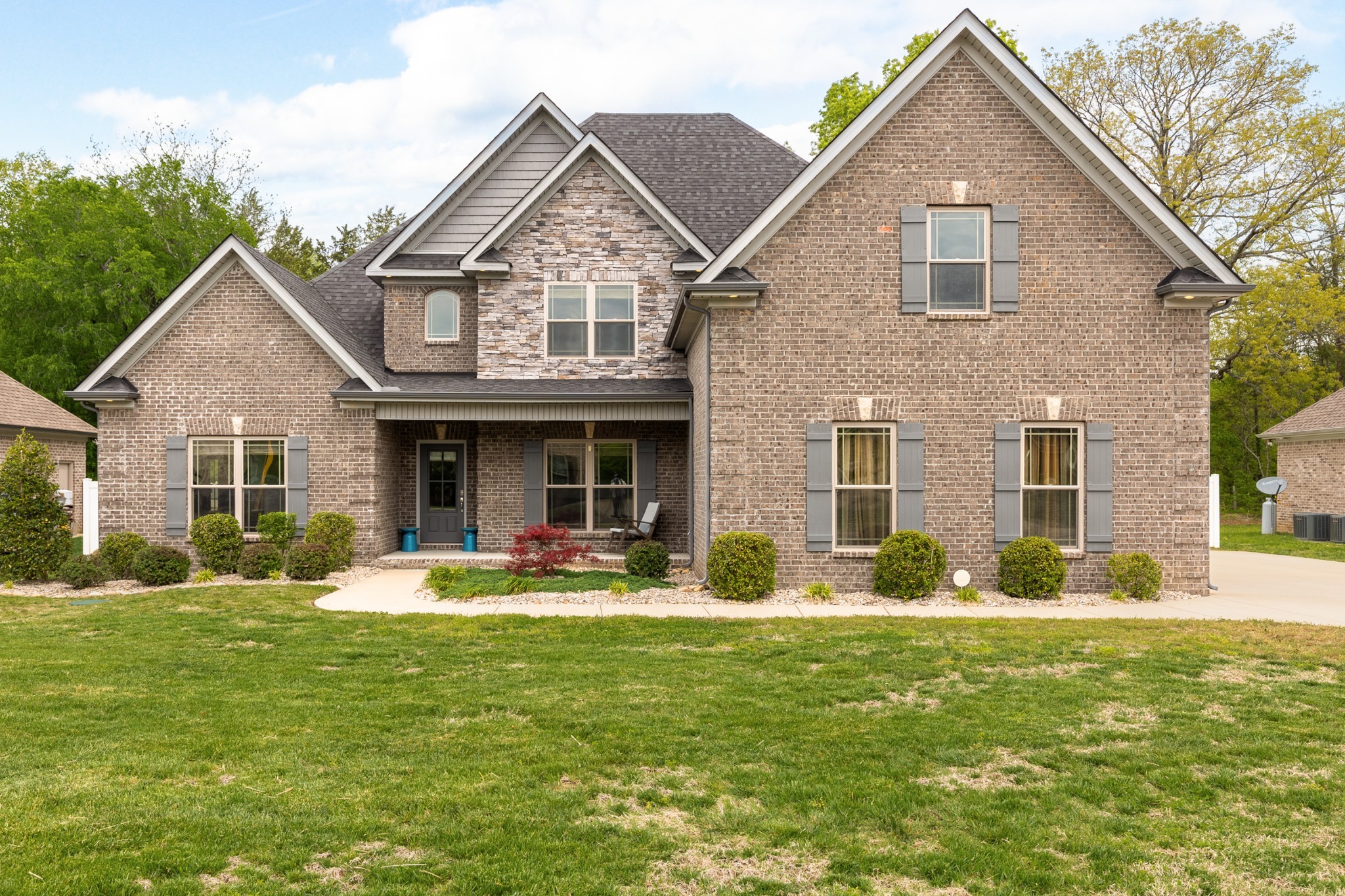 7970 Richpine Drive Murfreesboro, TN 37128 - Photo 1 of 30 a front view of a house with garden and porch