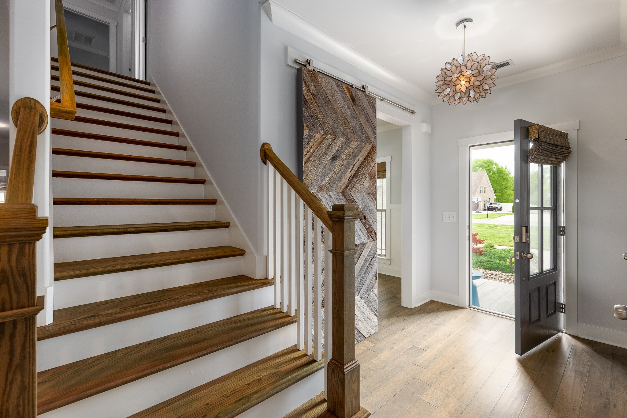 7970 Richpine Drive Murfreesboro, TN 37128 - Photo 2 of 30 a view of a hallway to room with wooden floor and windows
