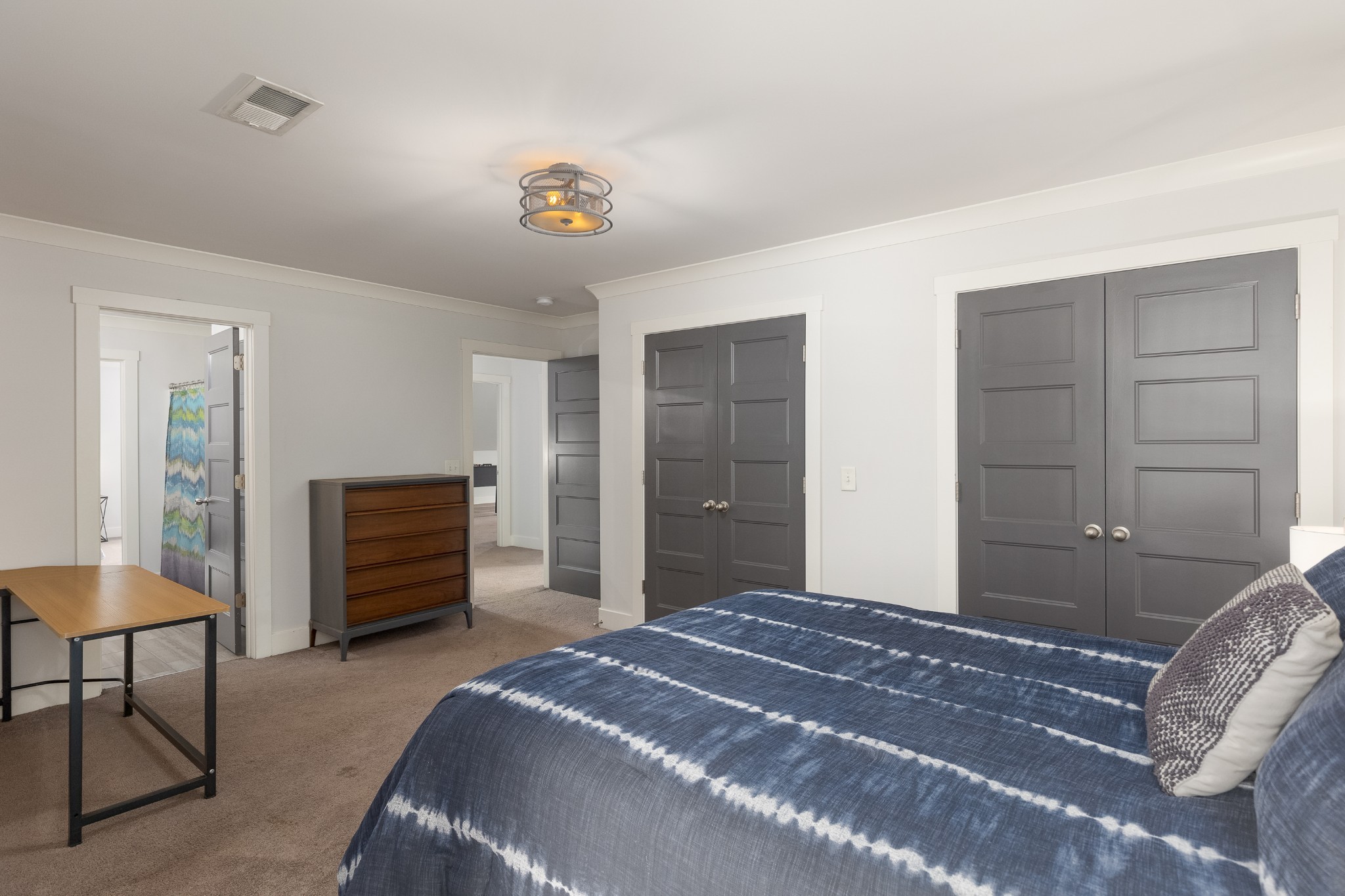 7970 Richpine Drive Murfreesboro, TN 37128 - Photo 25 of 30 a bedroom with a bed and a chandelier