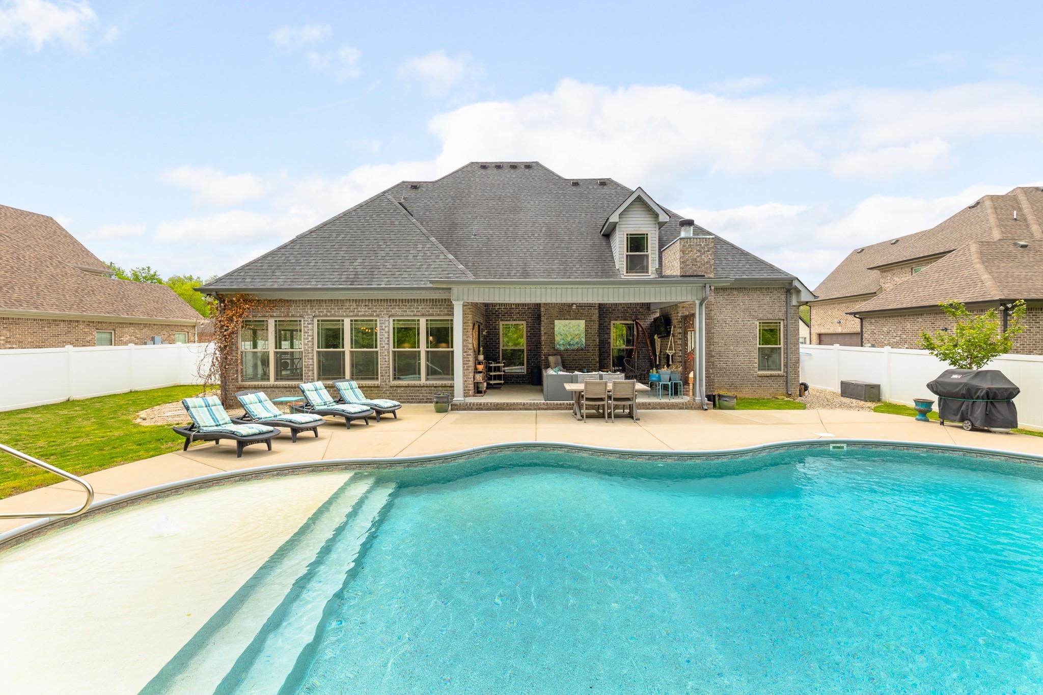7970 Richpine Drive Murfreesboro, TN 37128 - Photo 30 of 30 a swimming pool view with a seating space and a garden view