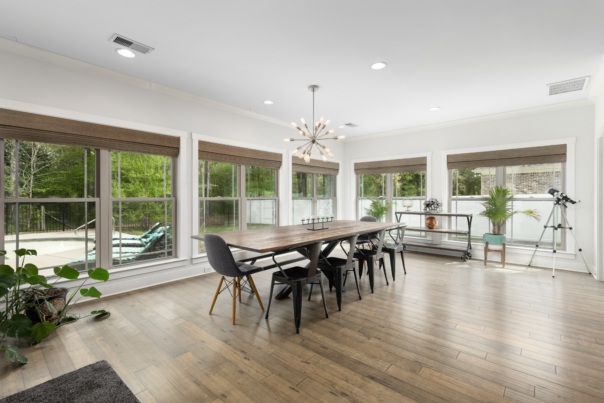 7970 Richpine Drive Murfreesboro, TN 37128 - Photo 9 of 30 a dining room with wooden floor a chandelier a wooden table and chairs