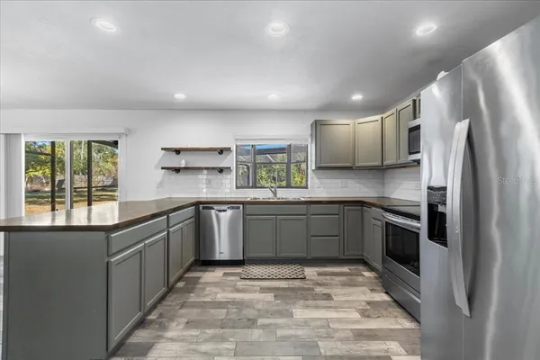 a bathroom with a shower and a sink