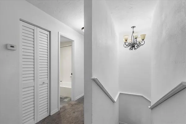 a bedroom with a large bed and a large window