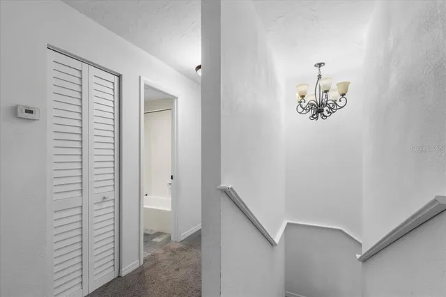 a bedroom with a large bed and a large window