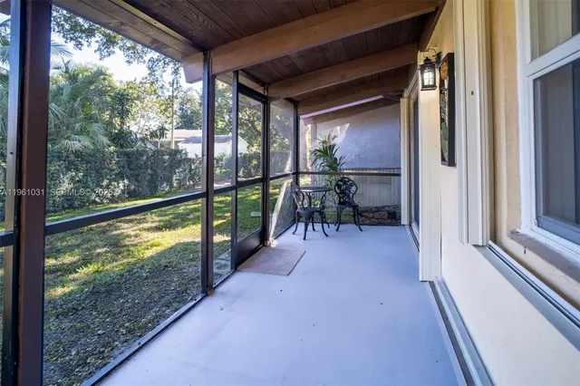 a view of porch with a furniture