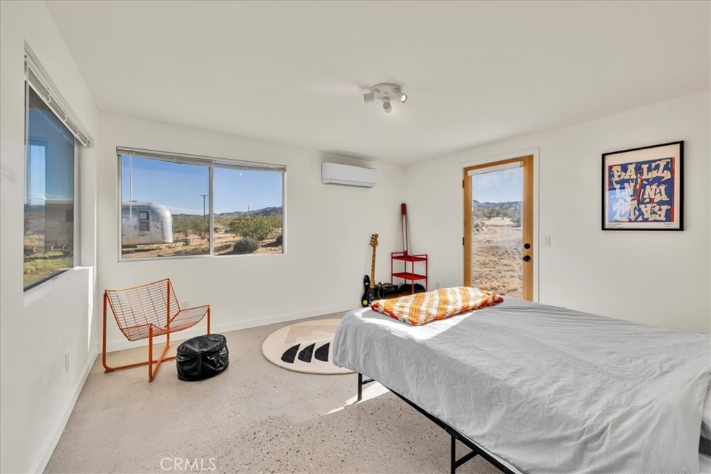 2625 Geronimo Trail Yucca Valley, CA 92285 - Photo 19 of 57 a living room with furniture and a table