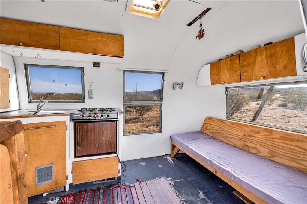 2625 Geronimo Trail Yucca Valley, CA 92285 - Photo 44 of 57 a bedroom with furniture and a window