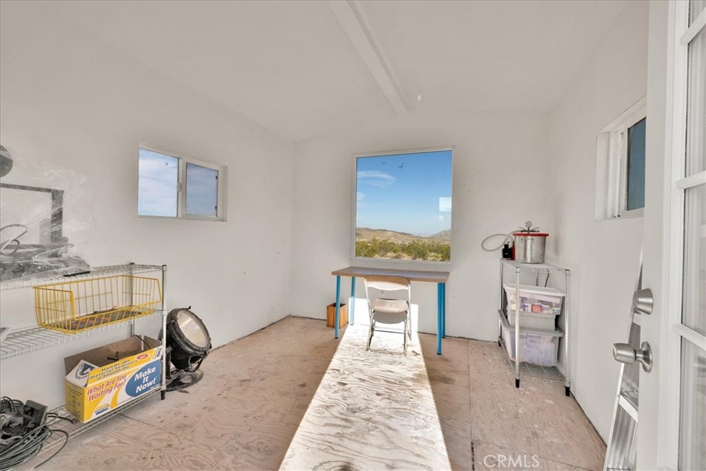 2625 Geronimo Trail Yucca Valley, CA 92285 - Photo 49 of 57 a room with a couch and a table in it