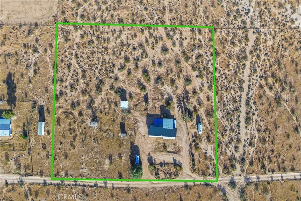 2625 Geronimo Trail Yucca Valley, CA 92285 - Photo 57 of 57 a picture of a street with a building in the background