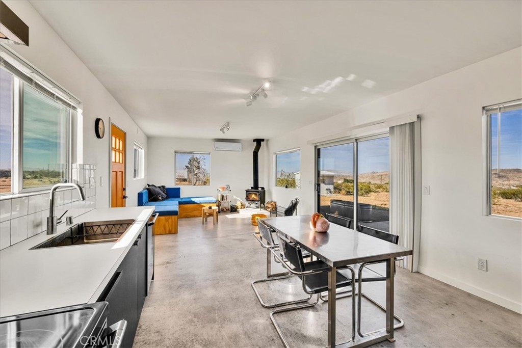 2625 Geronimo Trail Yucca Valley, CA 92285 - Photo 10 of 57 a living room with furniture and a wooden floor