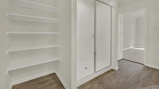 a view of an empty walk in closet