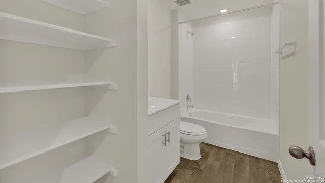 a bathroom with a sink toilet and a bathtub