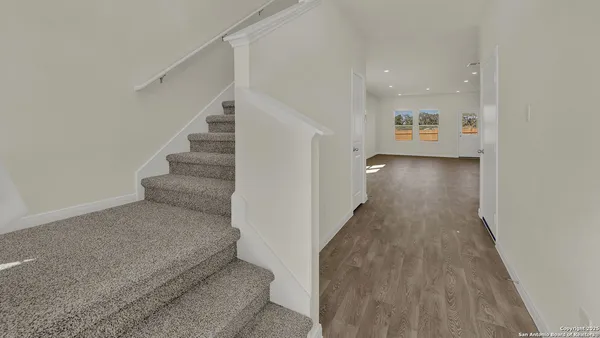 a room with cabinets and a wooden floor
