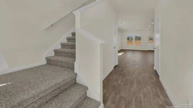 a room with cabinets and a wooden floor