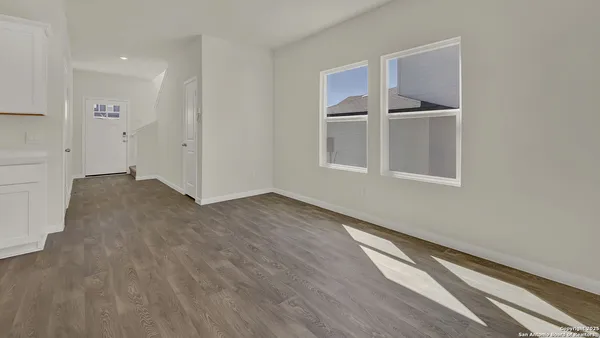 a kitchen with stainless steel appliances a refrigerator and a stove top oven