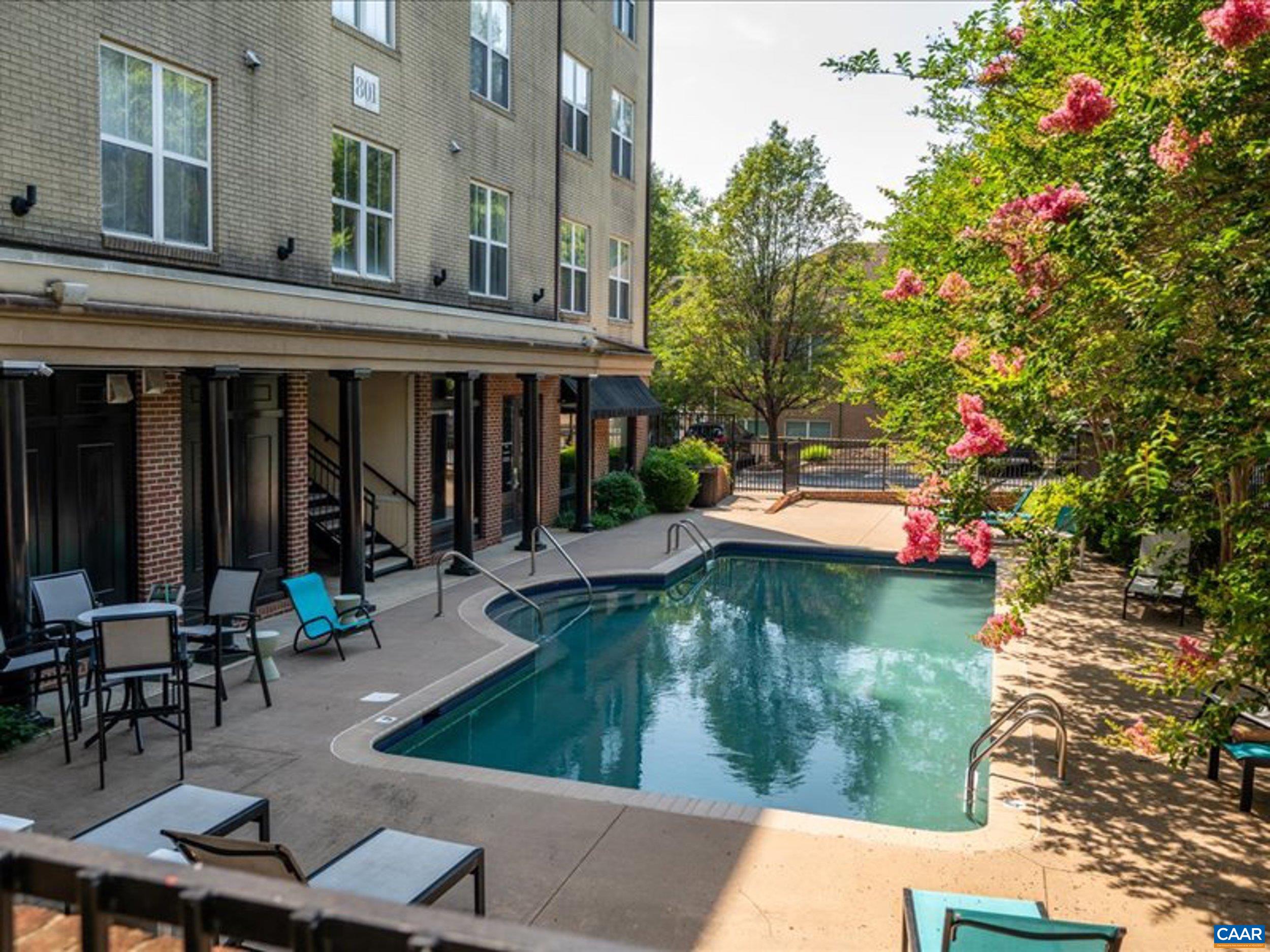 765 Walker Square, Unit 2D Charlottesville, VA 22903 - Photo 28 of 33 a swimming pool with outdoor seating and yard