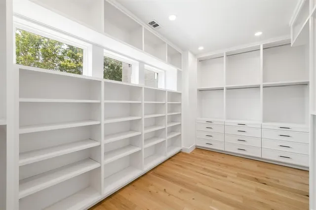a kitchen that has a lot of cabinets in it