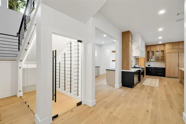 a kitchen with granite countertop white cabinets and stainless steel appliances