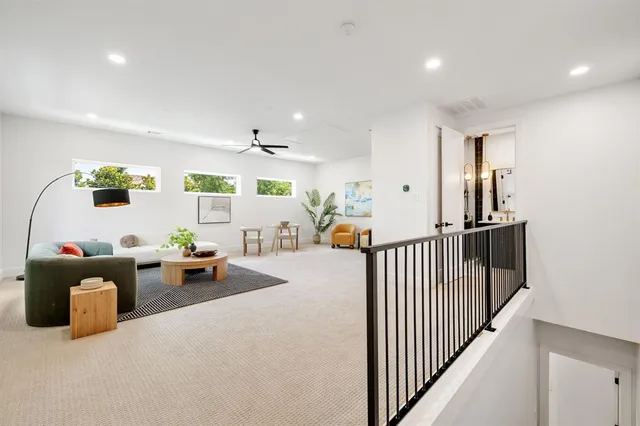 a view of a livingroom with furniture and windows