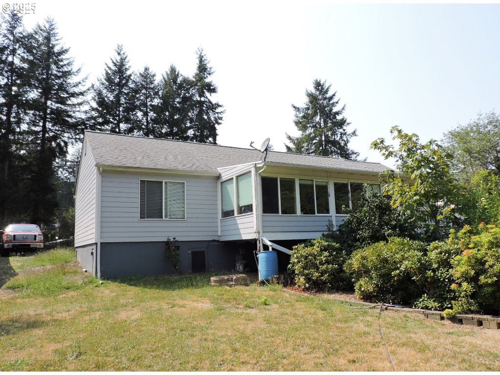 10742 Highway 126 Mapleton, OR 97453 - Photo 3 of 30 a front view of house with yard and trees in the background