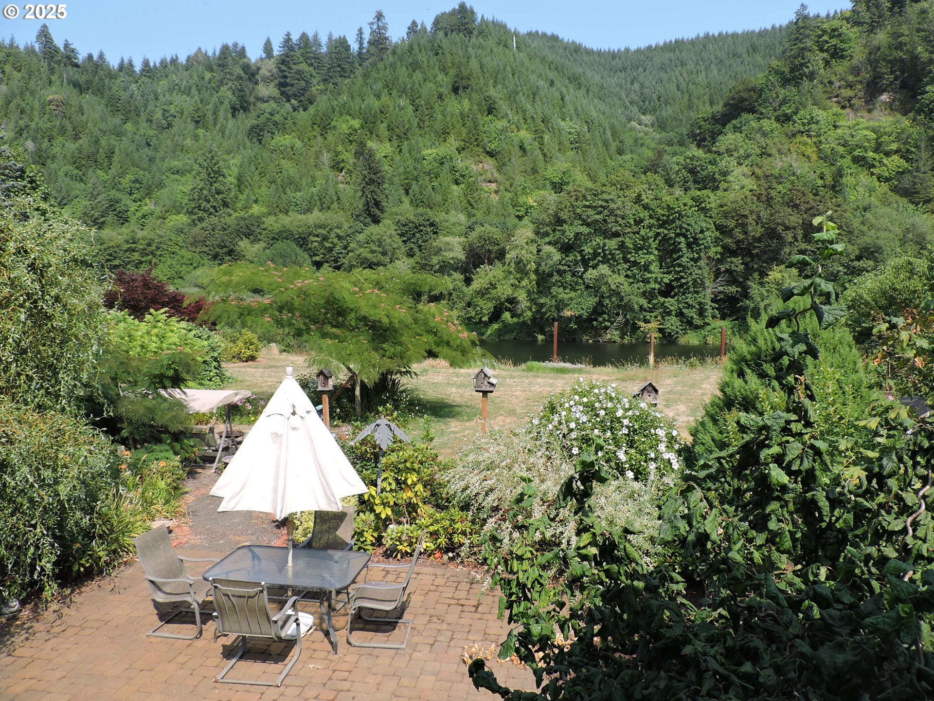 10742 Highway 126 Mapleton, OR 97453 - Photo 8 of 30 a view of a lake with a house