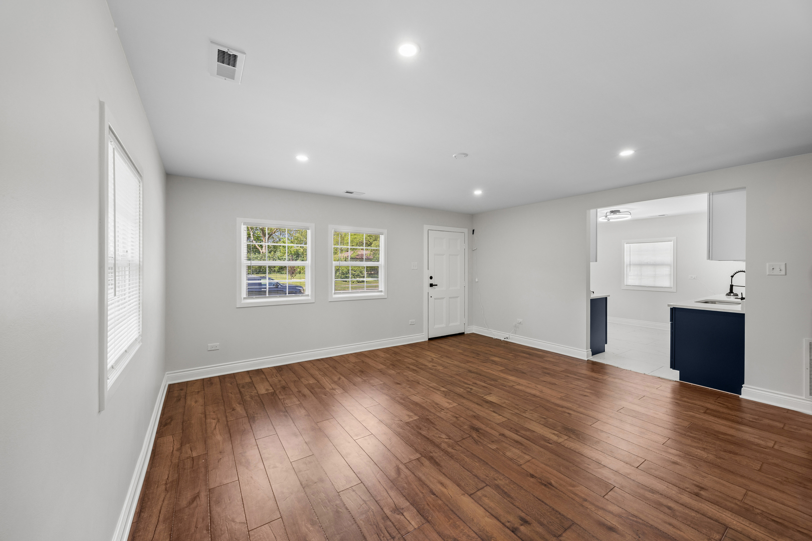 570 Andover Street Chicago Heights, IL 60411 - Photo 9 of 22 a view of empty room with wooden floor and window