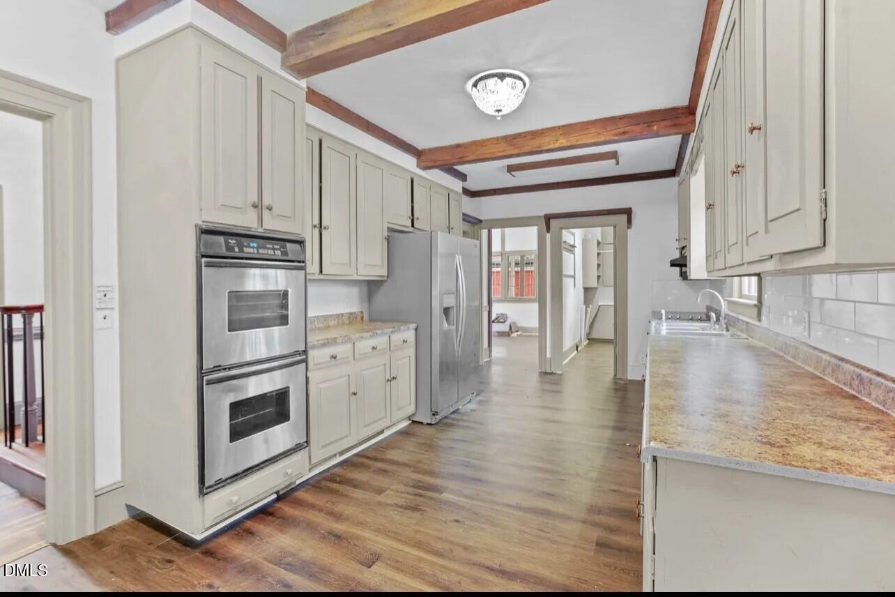 620 Falls Road Rocky Mount, NC 27804 - Photo 2 of 13 a kitchen with stainless steel appliances granite countertop a refrigerator and a stove