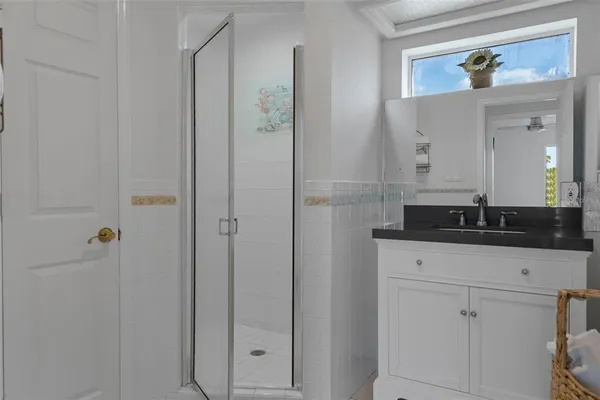 a bathroom with a sink a vanity and a mirror