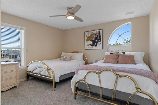 a bed sitting in a room next to a window