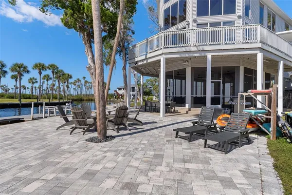 a view of a chairs and table in a patio