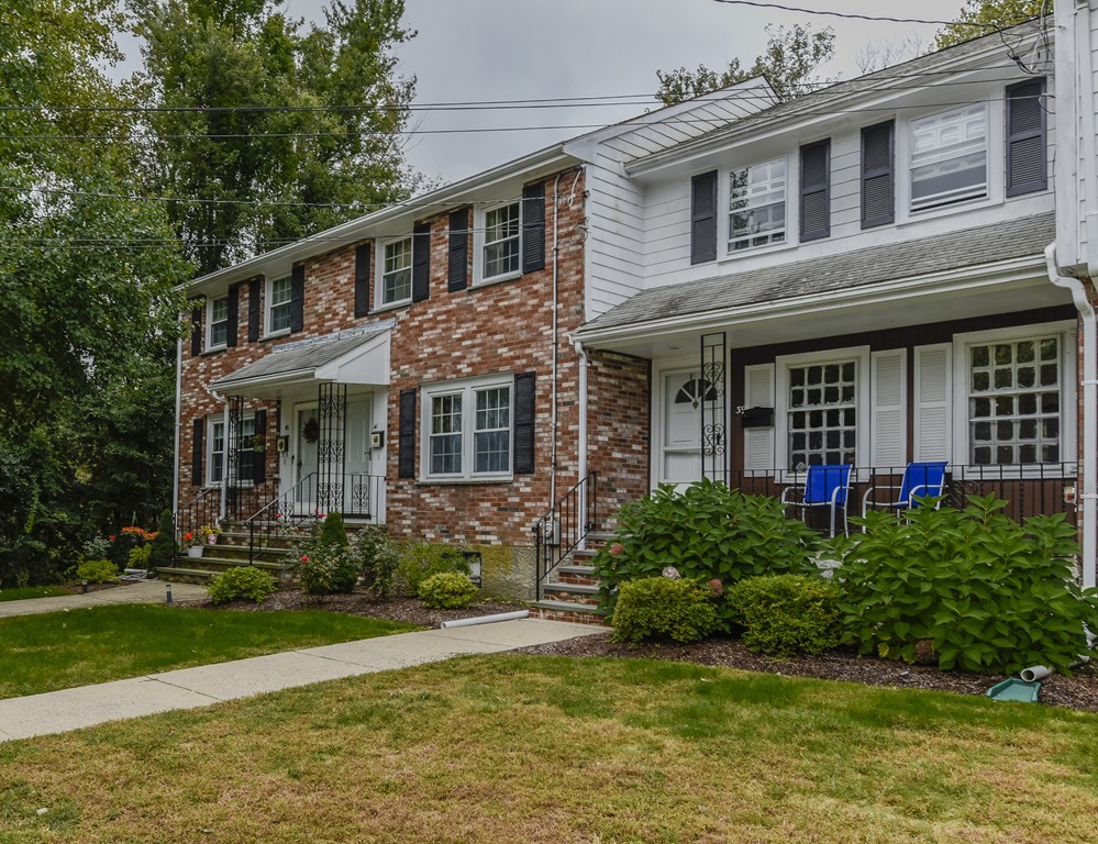39 Clough Road, Unit 39 Dedham, MA 02026 - Photo 2 of 19 a front view of a house with garden