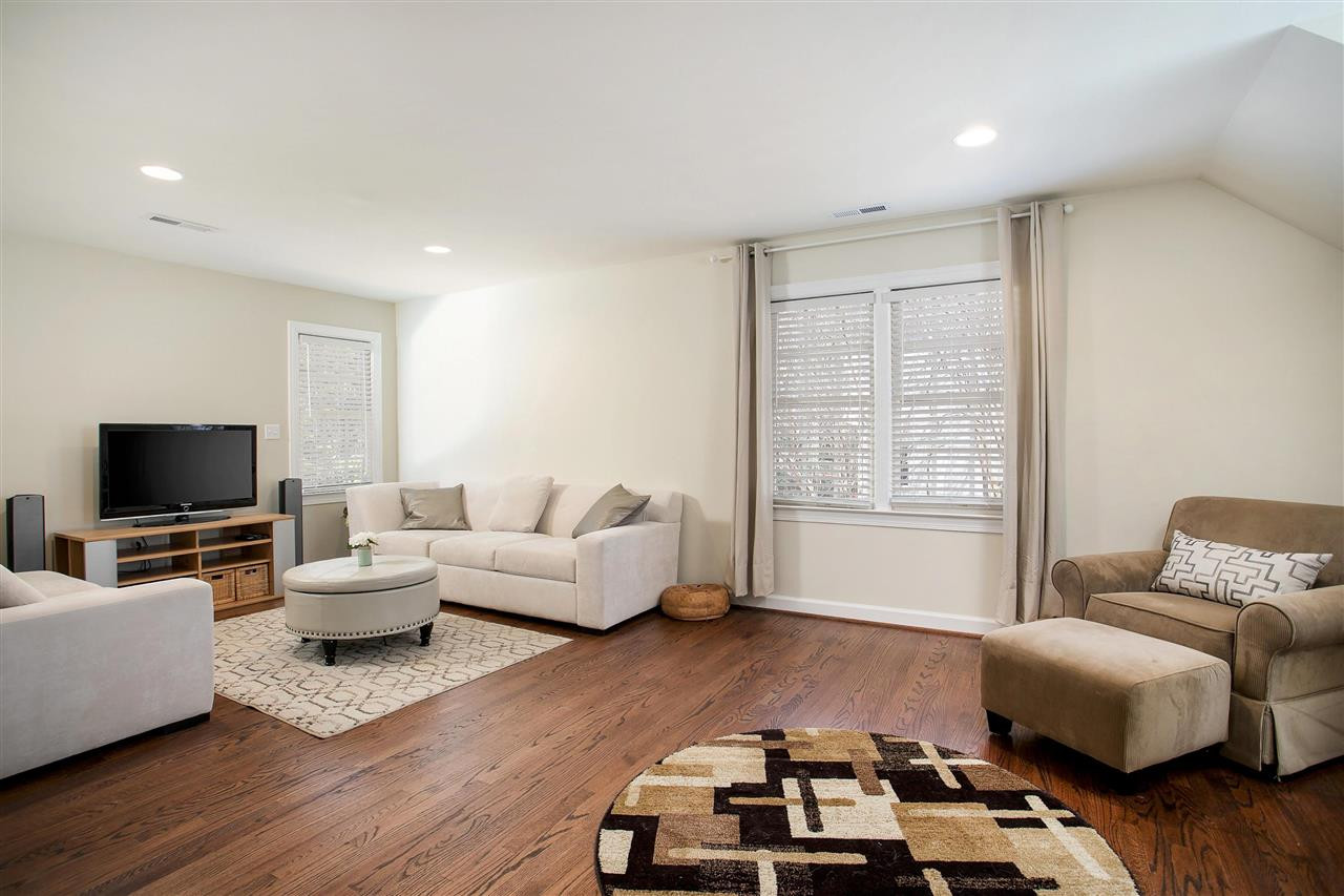 7102 Spring Ridge Road Cary, NC 27518 - Photo 20 of 25 THE IDEAL BONUS ROOM - OR USE IT AS A 4TH BEDROOM IF NEEDED! HUGE, SO MANY WINDOWS, BIG CLOSET AND THE HARDWOODS HERE TOO! BONUS ROOM