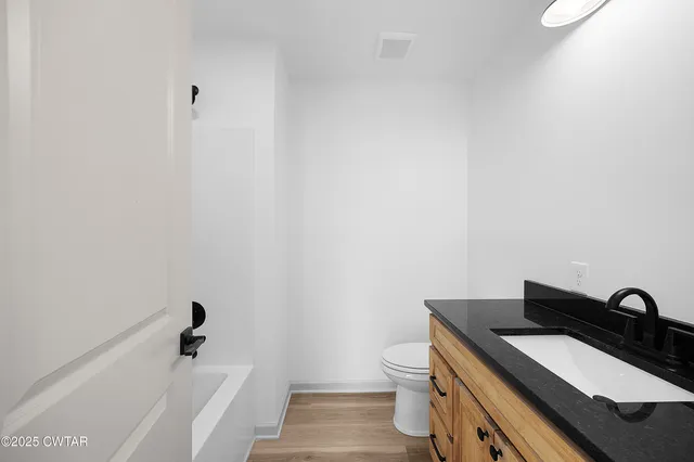 a bathroom with a sink and a toilet