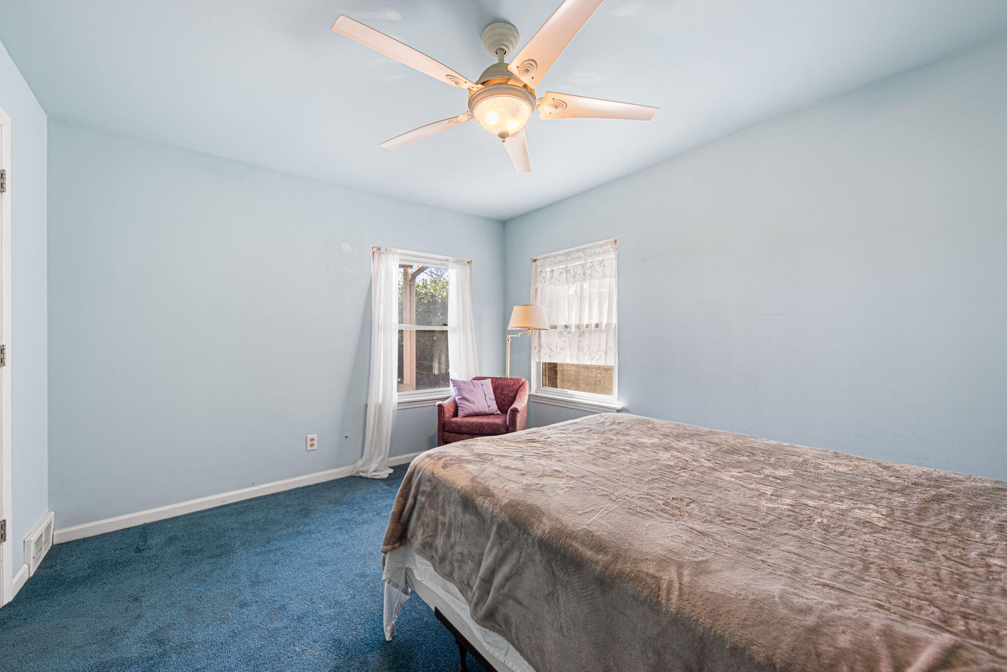 8632 Oak Avenue Gary, IN 46403 - Photo 15 of 34 a bedroom with a bed and a chandelier