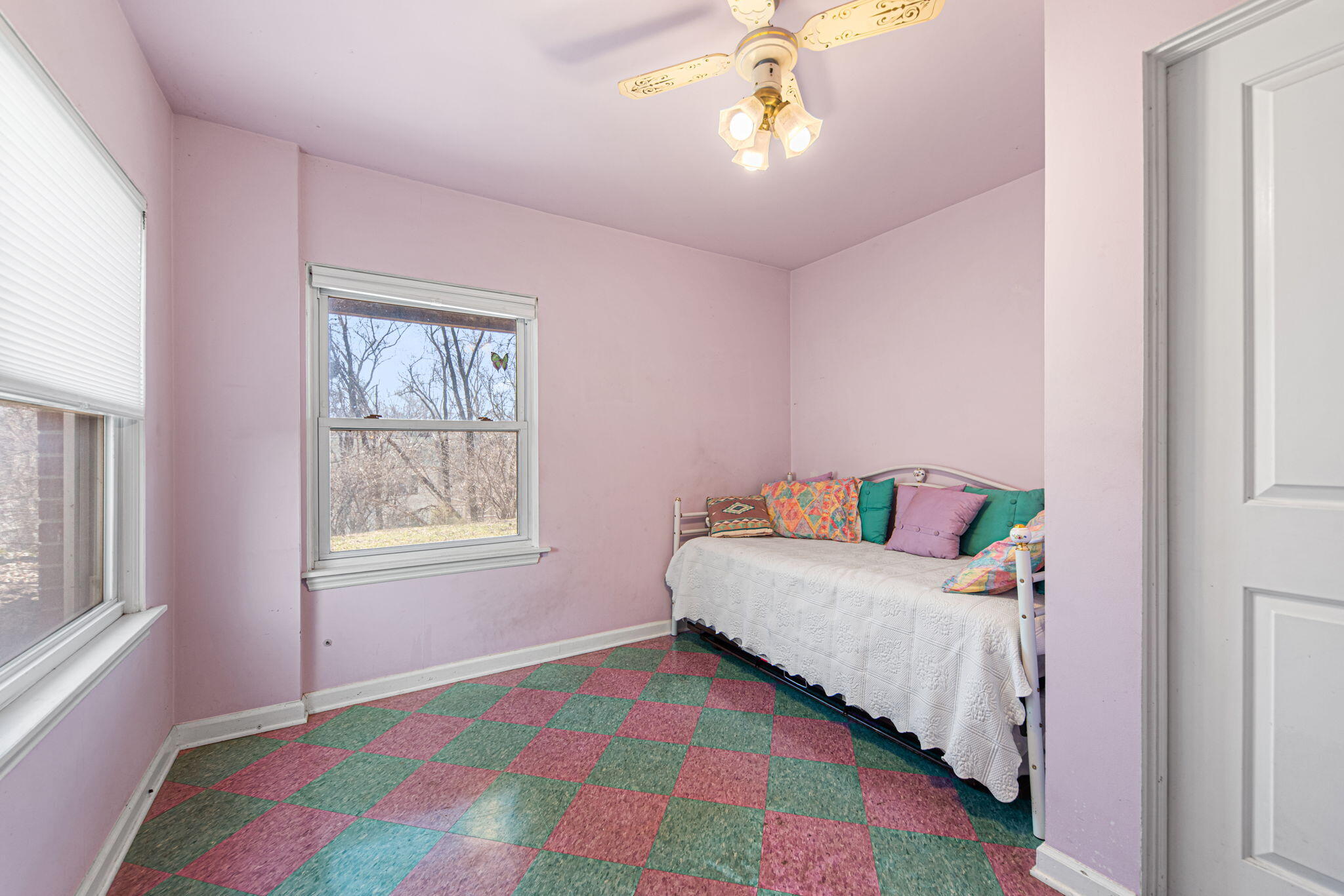 8632 Oak Avenue Gary, IN 46403 - Photo 16 of 34 a bedroom with a bed and a chandelier