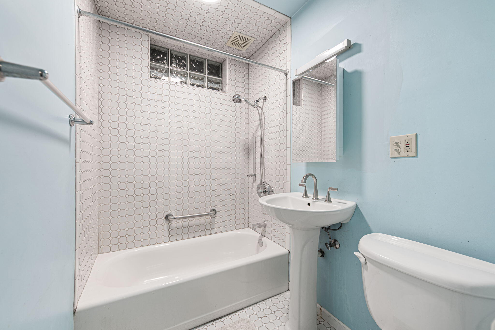 8632 Oak Avenue Gary, IN 46403 - Photo 17 of 34 a bathroom with a sink a toilet and shower