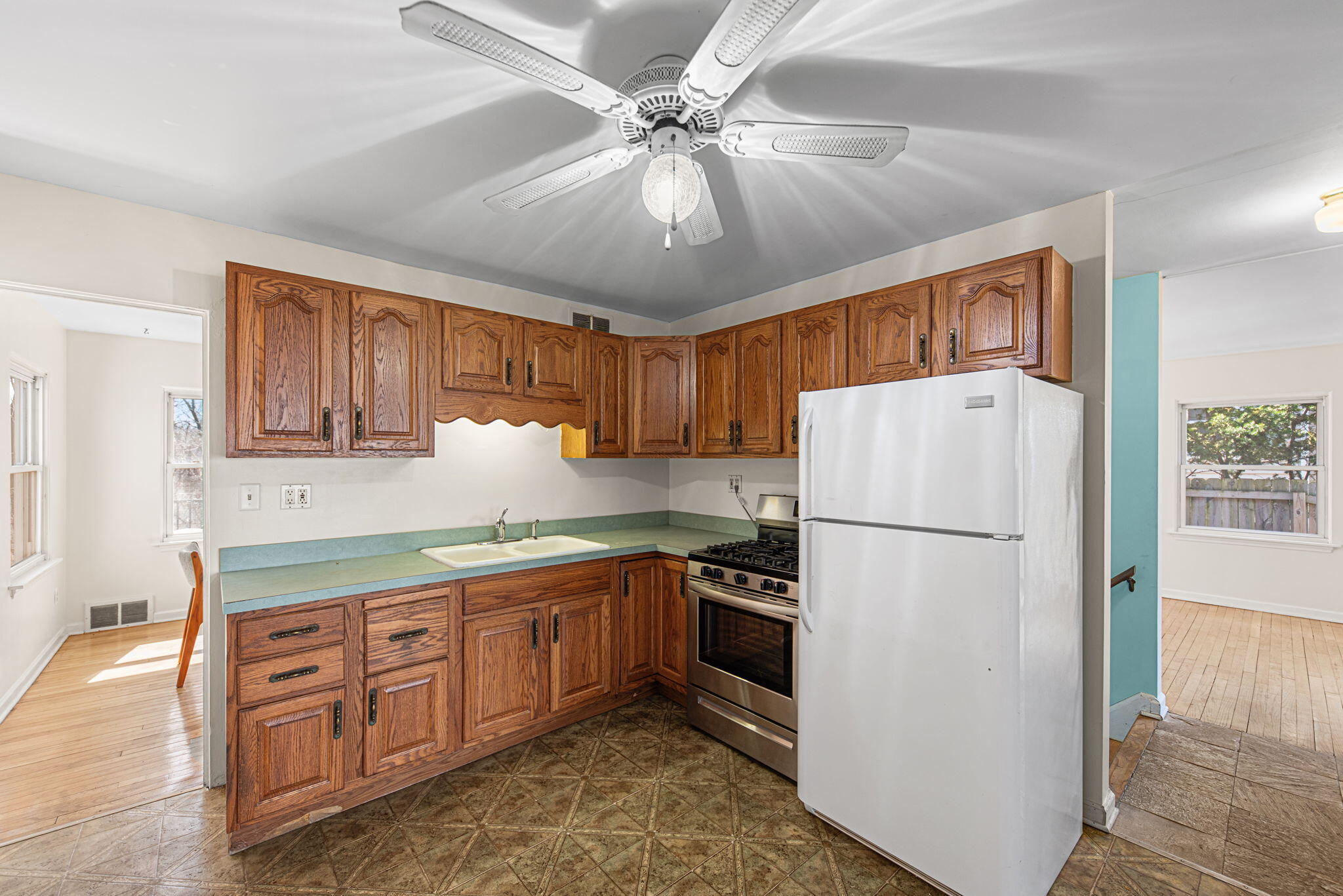 8632 Oak Avenue Gary, IN 46403 - Photo 9 of 34 a kitchen with appliances cabinets and a refrigerator