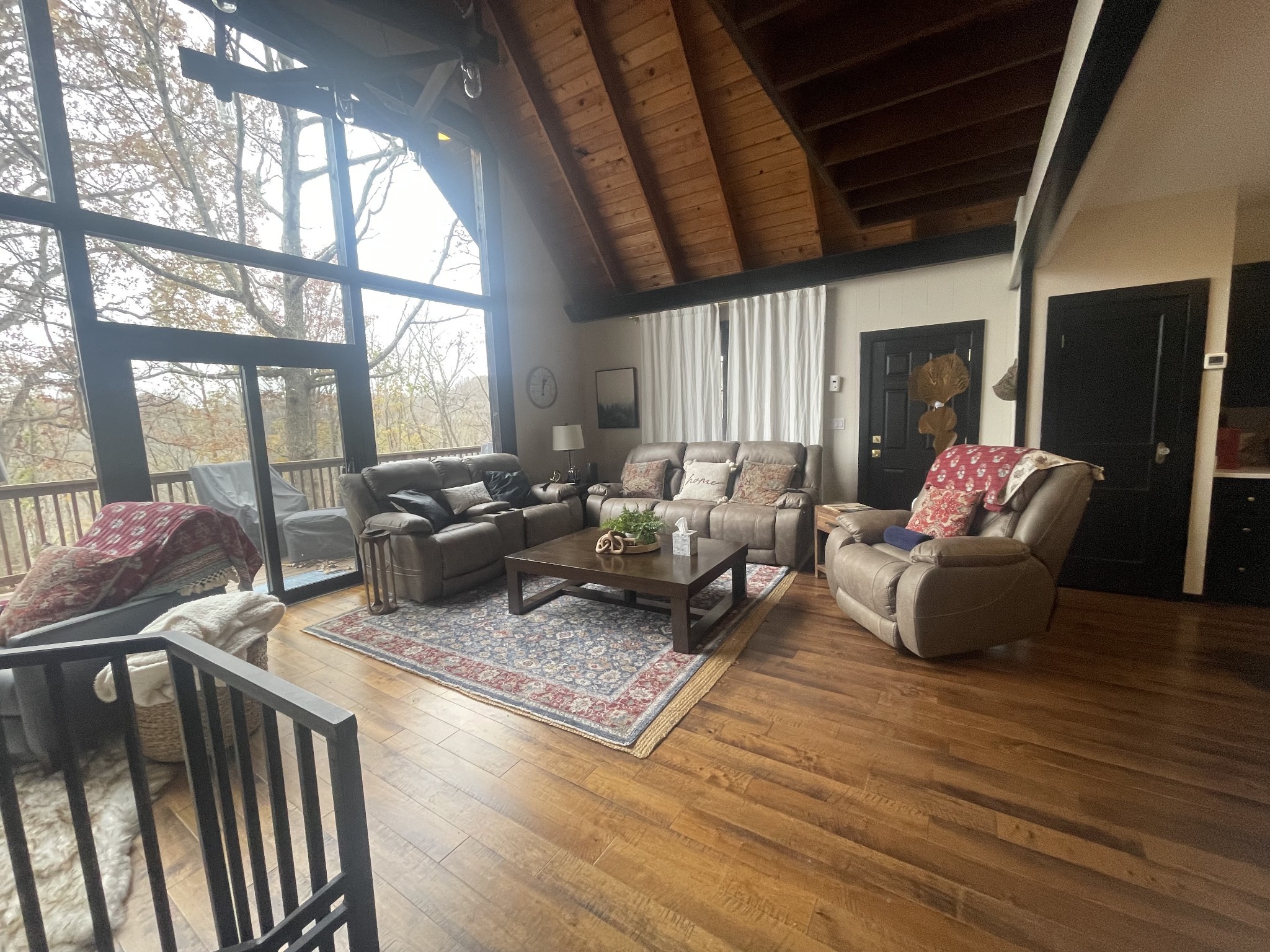 2029 Holly Creek Road Celina, TN 38551 - Photo 3 of 39 a living room with furniture large window and wooden floor
