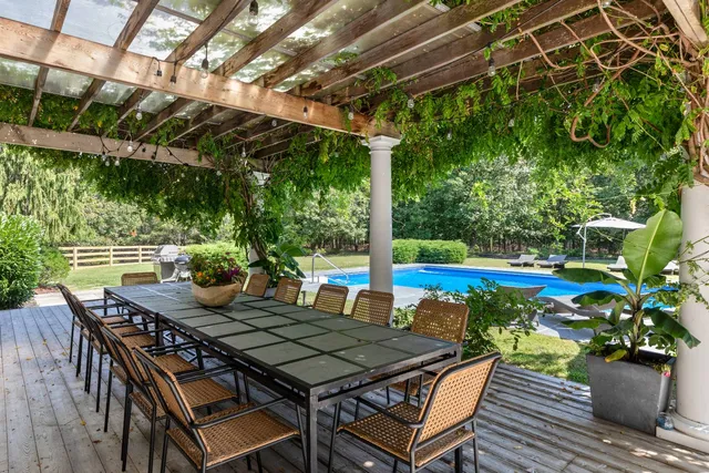 a view of an outdoor sitting area with furniture
